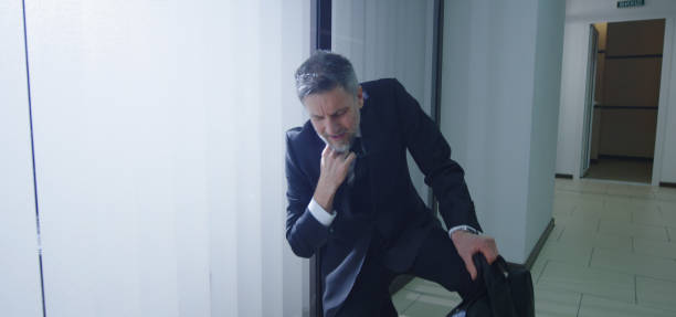 istock Coworkers running to help ill manager 1212557198