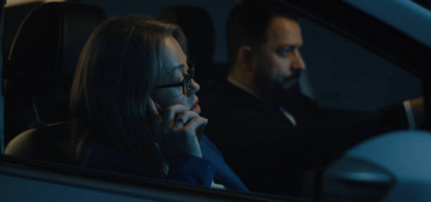 istock Man driving and woman phoning 1212557351