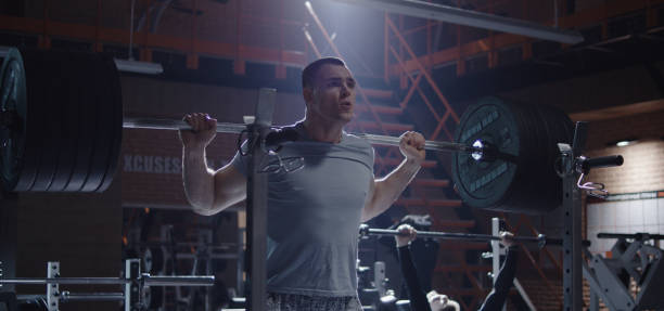 istock Young man working out in gym 1212557544