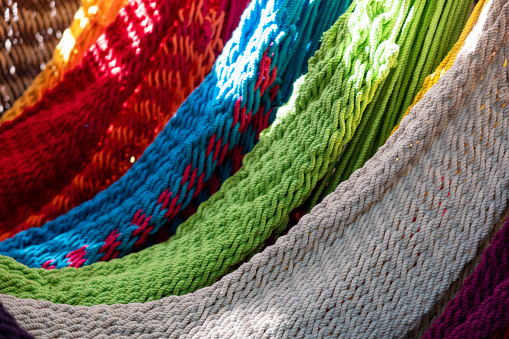 Close-up of multi-colored hammocks, open air market in India