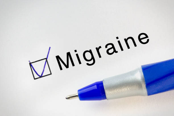 istock Migraine text on test paper with check mark in form box. Diseases names test series. 1212558545