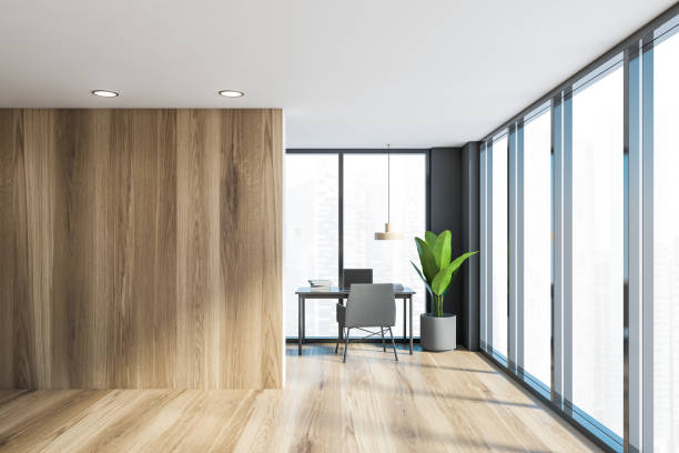 istock Gray and wooden home office interior 1212558792