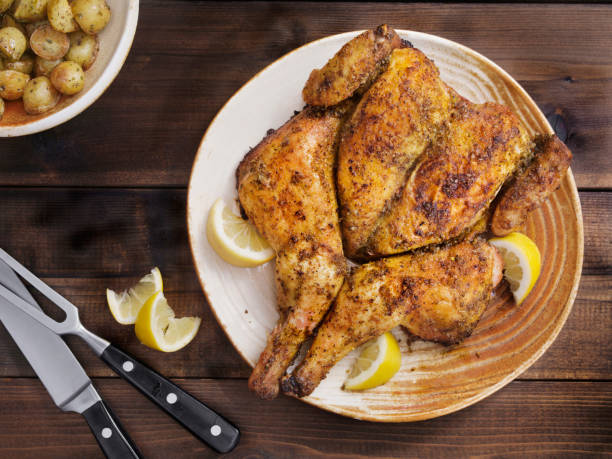 istock Roasted Spatchcock Lemon Chicken with Roasted Potatoes 1212558998
