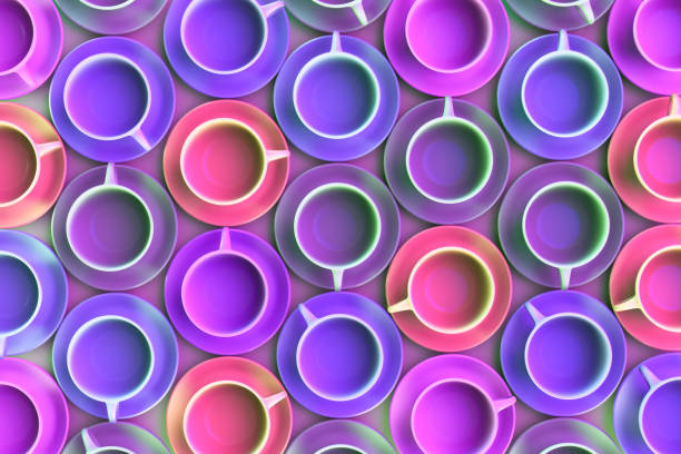 A lot of colored tea mugs on the table. View from above.