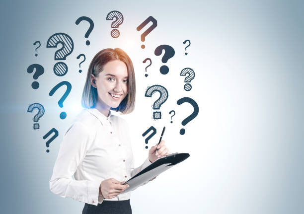 istock Woman with clipboard and question marks 1212559267