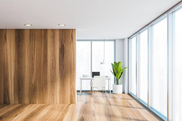 istock White and wooden home office interior 1212559529