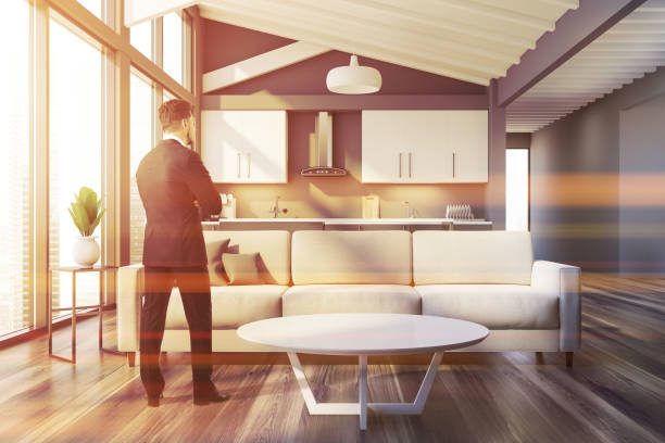 istock Man in gray attic living room and kitchen 1212560251