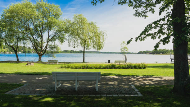 istock park bench and view to lake Krakower See 1212561949
