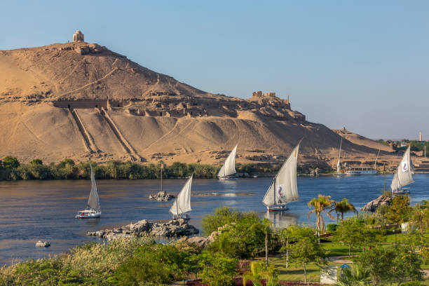 Tombs of the nobles mountain in Aswan Egypt Africa, Egypt, Middle East, Nile River, River felucca boat stock pictures, royalty-free photos & images