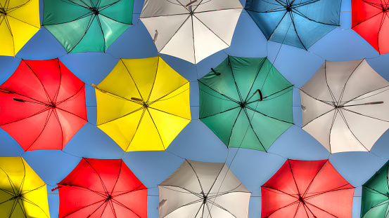 Rain, umbrellas, colorfull, blue sky, in a row