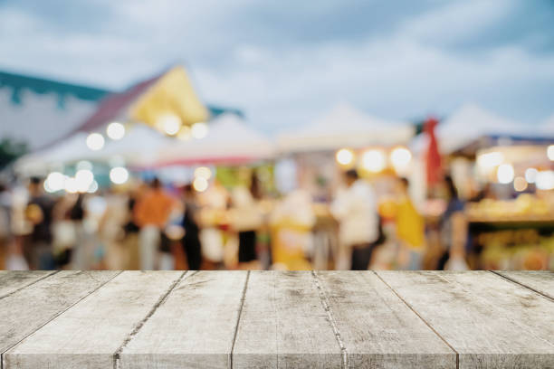 istock Empty wood table and blurred light table in shopping mall with bokeh background. product display template. 1212565056