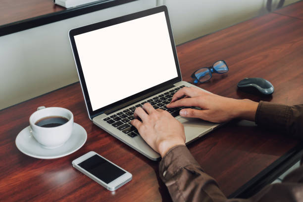 istock business man hand texting laptop on wooden table 1212565295