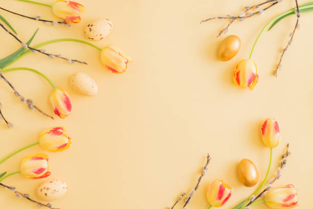 istock Flat lay easter composition with yellow tulips and eggs on a yellow background 1212568205