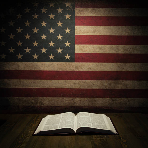 istock Holy Bible with vintage American Flag 1212568253