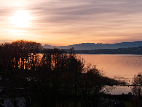 Beautiful view of the Lake Murten or Lake Morat in Switzerland at sunset.