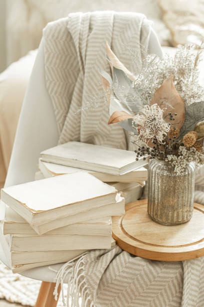 istock Home interior with books and dried flowers. 1212571234