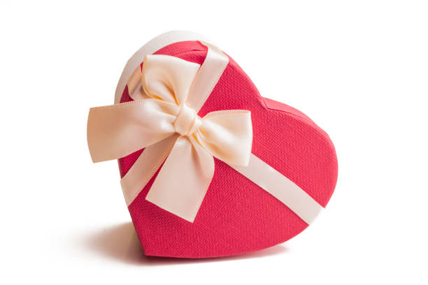 istock Heart shape gift box. Red with satin ribbon 1212571357