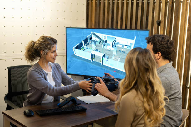 Interior designer talking to a couple about their housing project and using 3D technology to see the designs  **DESIGN ON SCREEN WAS MADE FROM SCRATCH BY US**