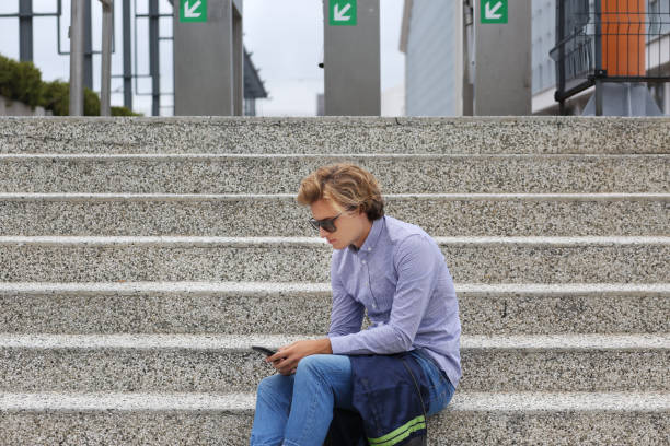 istock Teenage boy typing text message.Using smart phone. 1212572213