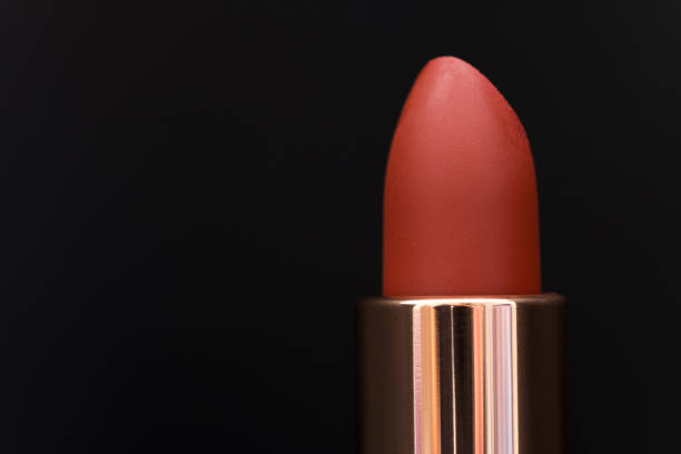 istock Red color lipstick isolated on black background view 1212572335