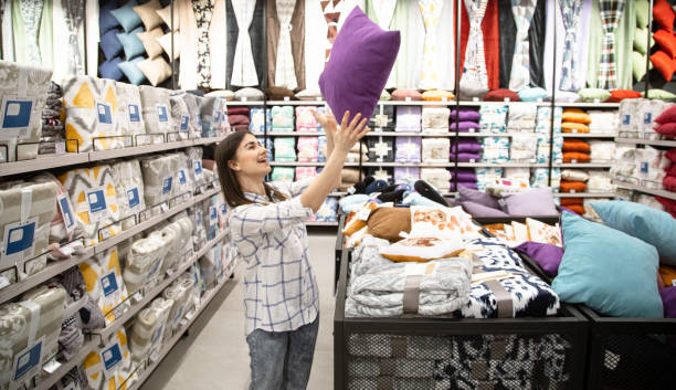 istock A young woman in a store chooses textiles. 1212572652