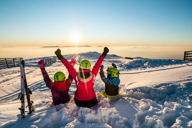 istock Family with hands raised 1212575357