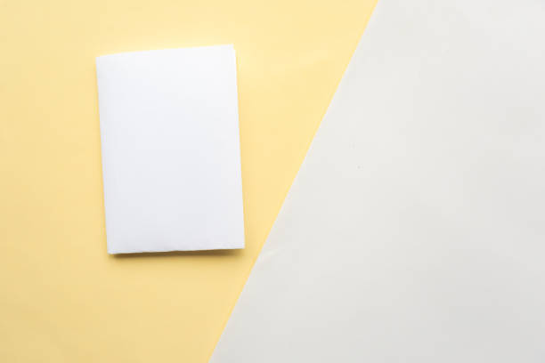 istock White mockup blank on geometric yellow and white paper background texture 1212577592