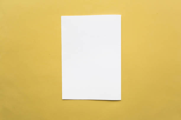 istock White mockup blank on yellow bacakground 1212577643