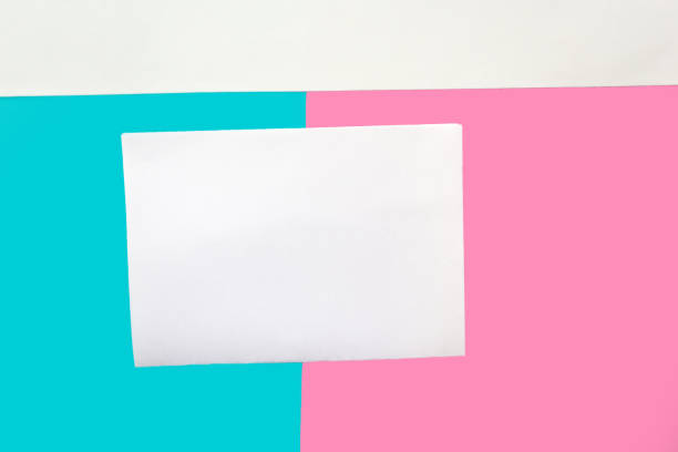 istock White mockup blank on geometric pink, white and blue paper background texture 1212577694