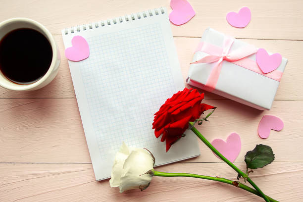istock Love composition - coffee cup, gift box and red rose on pink background, top view. Valentines Day greeting card 1212577705