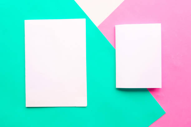 istock Two white mockup blanks on geometric green, pink and white background. Copy space for the text. Minimal concept 1212577779