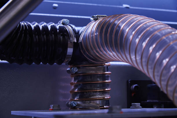 istock Plastic hoses for removing sawdust from the cutting area in a woodworking machine 1212578297