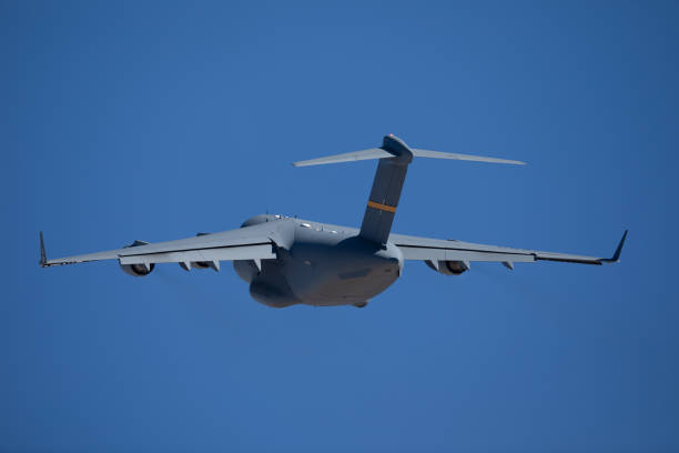 Tail view of a C-17 Globemaster III climbing