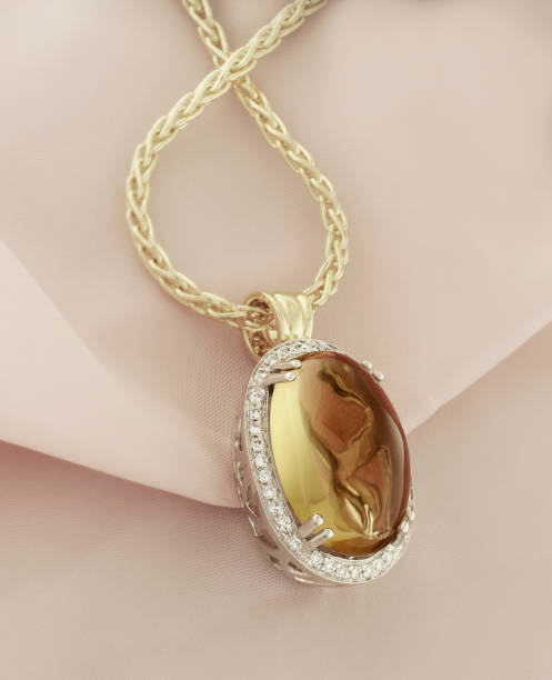 istock Gold Pendant With Lime Quartz And Diamonds 1212579839