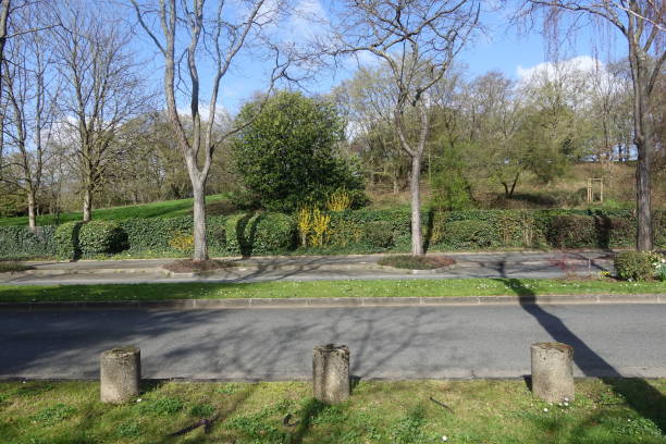 istock Solid road in front of a public park in the Paris region 1212580623