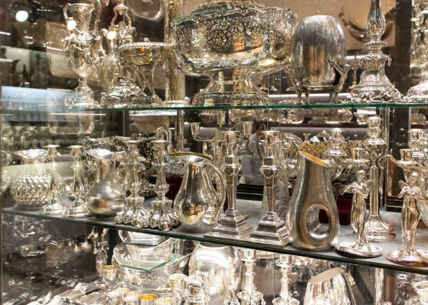 istock Silver tableware on showcase in front of the store. Close up. 1212580933
