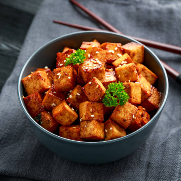 istock Fried Tofu in a bowl with chopstick and sesame seeds 1212582069