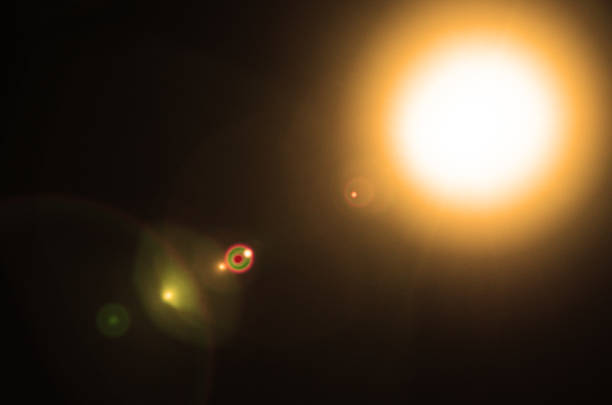 istock Abstract Natural Sun flare or Far star on the black background 1212582813