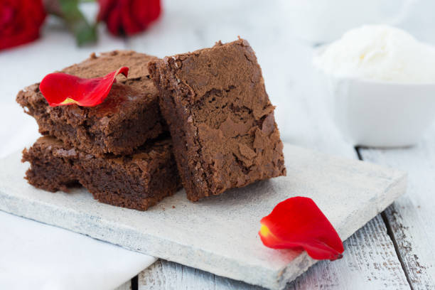 istock Plate with fresh brownies and ice-cream on table. Delicious chocolate pie 1212583614