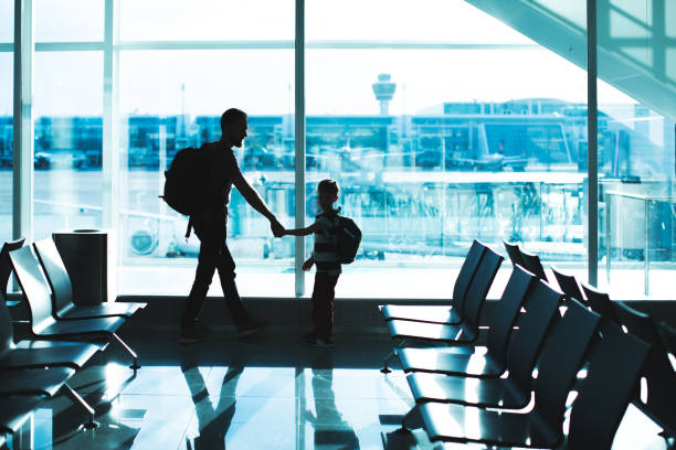 istock Father and son at the airport 1212583699