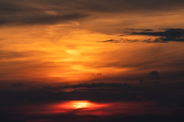 Beautiful colorful bright sunset sky with clouds. Nature sky background.