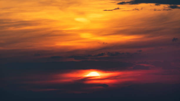 istock Beautiful colorful bright sunset sky with clouds. Nature sky background. 1212584115