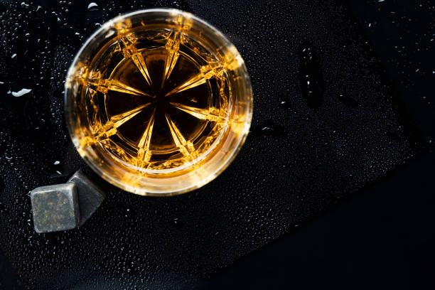 istock One whiskey glass with stone 1212584194