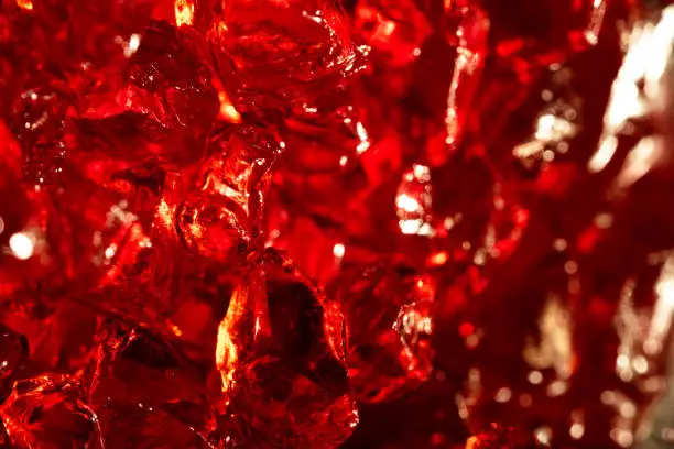 Macro photo of red gems stone quartz on a background. Closeup of texture mineral.