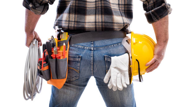 istock Electrician with tool belt on a white background. Electricity. 1212585407