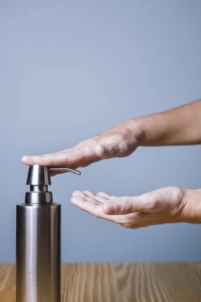 istock hands putting on soap with a dispenser 1212586707