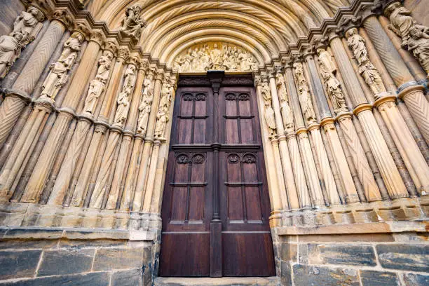 Grand doors of Dresden Frauenkirche in Germany. Entrance in high arch with a lot of sculpture in it and statues on walls. Architecture of Europe.