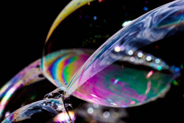 istock Macro photography of various soap bubbles creating different shapes 1212589123
