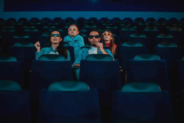 istock Family in the cinema 1212590624