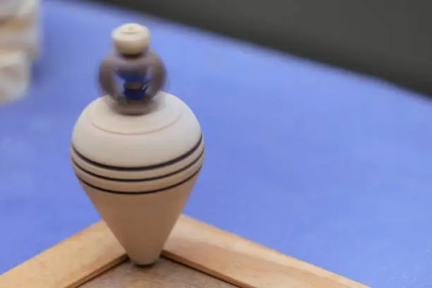 Close-up of a wooden spinning top. Vintage toy